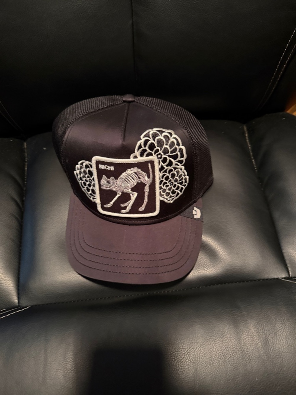 Black Trucker Cap with Embroidered Skeleton Cat Patch Michi
